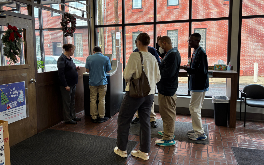 Class from Franklin Towne Charter High School in the lobby of PRS learning about bank accounts