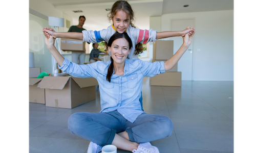 Mother and child sitting in new house