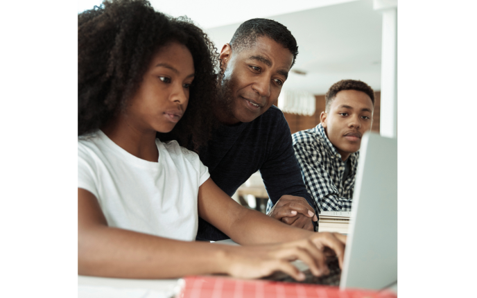 Father Teaching Children About Personal Finance on a Computer